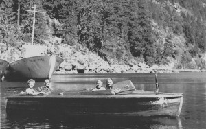 fairmiles00251 At Malibu Club, British Columbia about 1948. Tom Hamilton in his boat with a couple of guests. In the background, the Malinu Tyee. Chaz Hitz collection